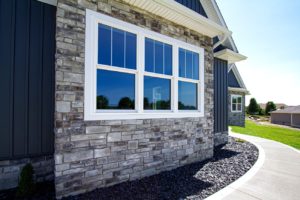 Hung windows with entrance door on exterior of home