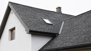 close up of sloping gray asphalt roof
